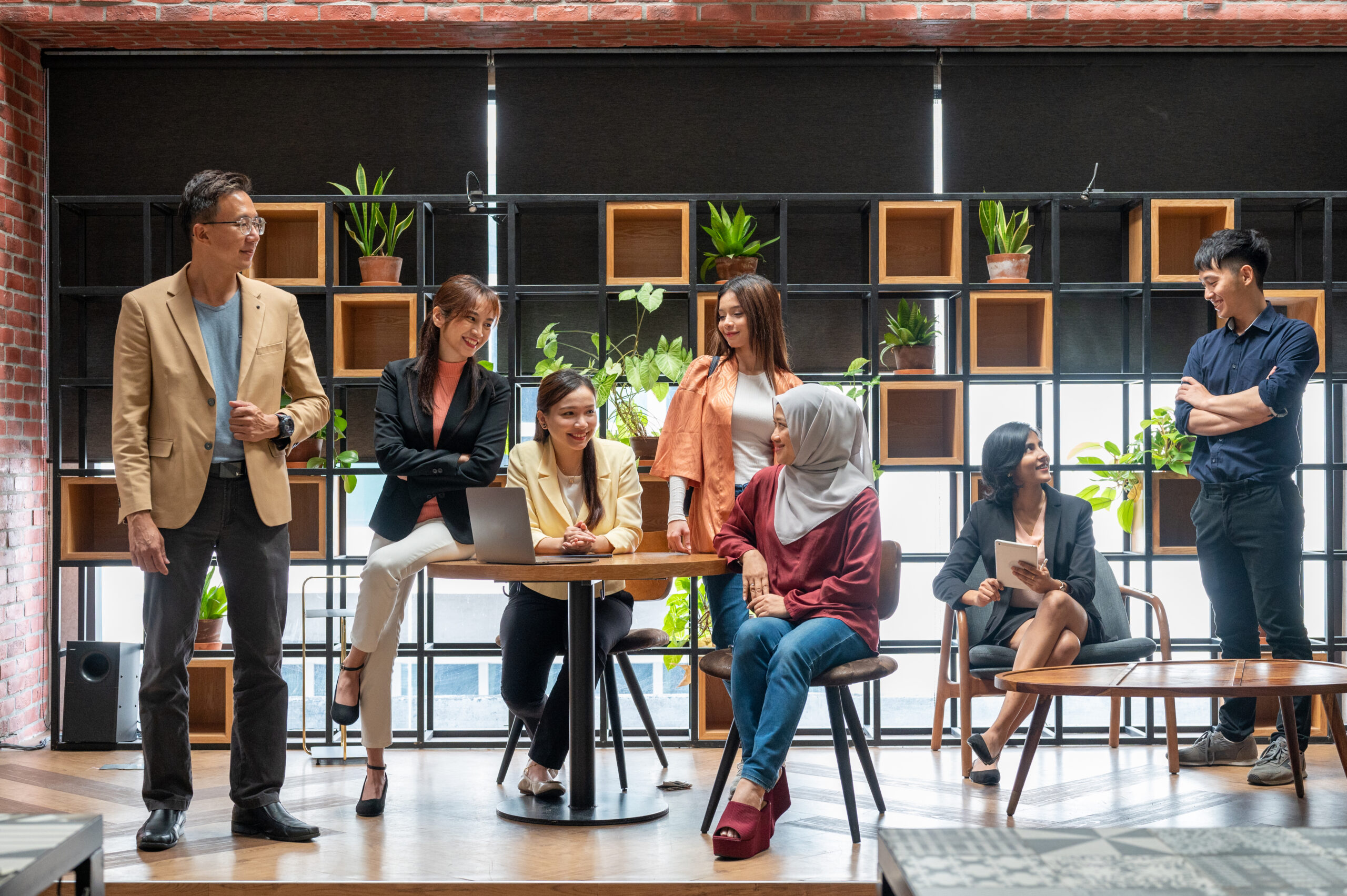 Smiling corporate Multi-ethnic business team, group portrait at coworking space